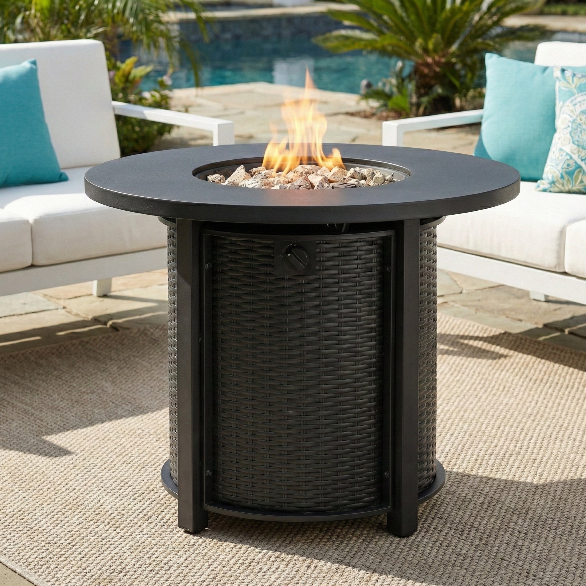 30-inch round propane fire pit table with flame on, black steel